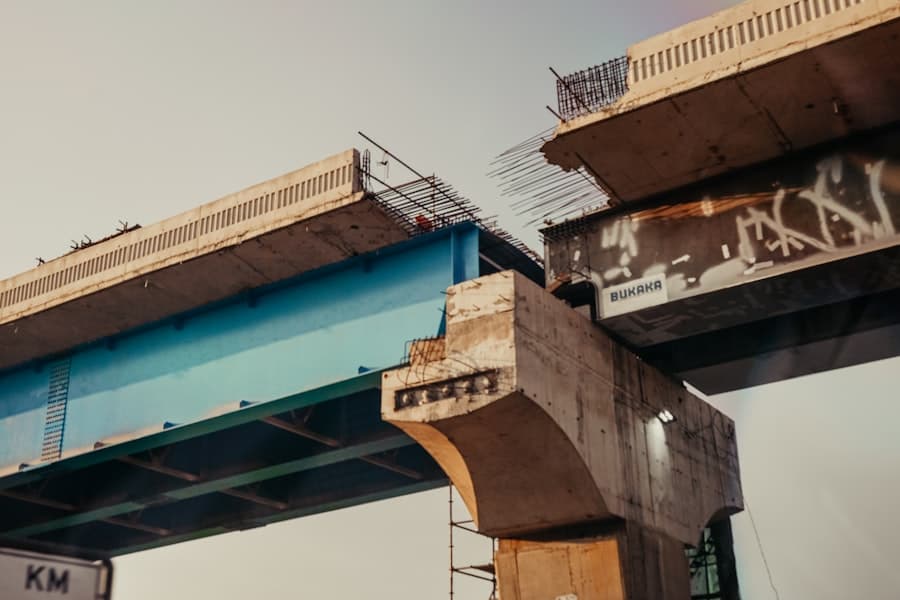 A deteriorating concrete bridge with exposed rebar